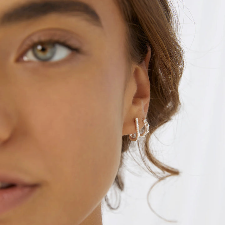 Arms Of Eve Holi Silver Huggie Earrings