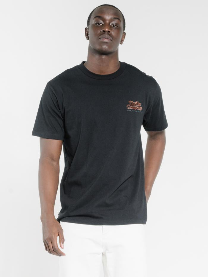Company Pipeline Stack Merch Fit Tee- Black